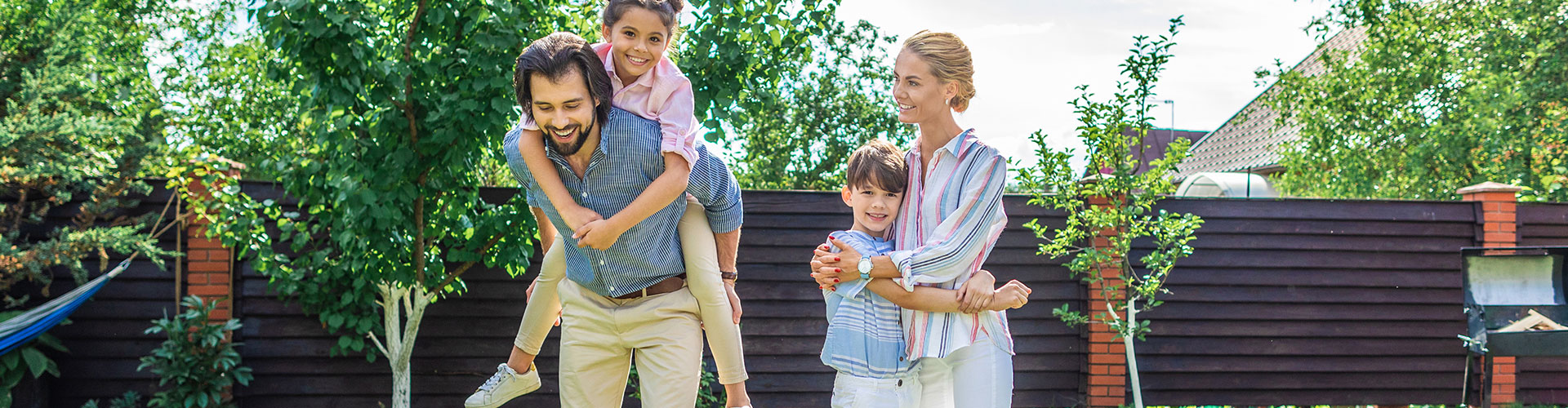 Family Spending Time Together On Backyard On Summer Day